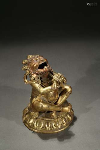 A gilt-copper figure of Tibetan deity