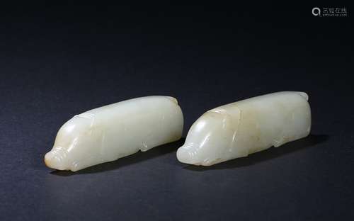 A pair of white jade 'pigs' carvings