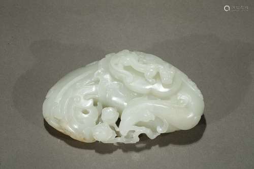 A white jade 'phoenix and chilong' washer