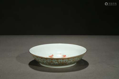 A celadon ground gilt-painted 'floral' dish