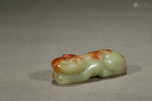 A yellow jade recumbent beast paper weight