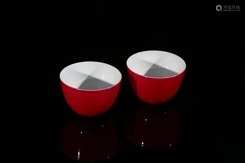 A pair of ruby-red glazed cups