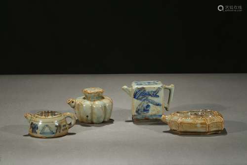 Group of four miniature blue and white ewers