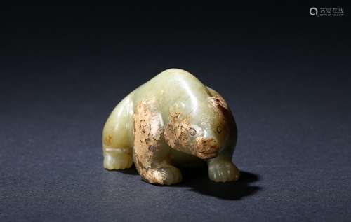 An archaic green jade carving of bear