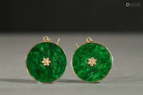 A pair of circular jadeite ear pendants