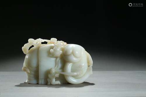 A jade carving of elephant and boys