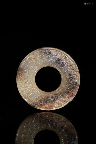 A mottled white and russet jade disc bi