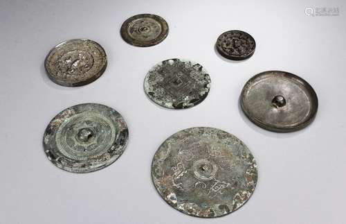 A group of seven archaic bronze mirrors