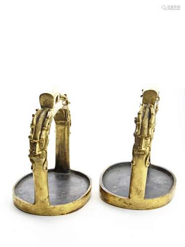 A pair of gilt bronze 'dragon' horse stirrups