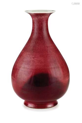 A RED FLAMBÉ-GLAZED PORCELAIN BOTTLE VASE, QING DYNASTY, SEAL MARK AND OF THE PERIOD QIANLONG (1736-1795)