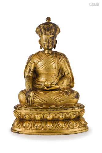 A GILT BRONZE SEATED FIGURE OF A LAMA, SINO-TIBET, 18TH-19TH CENTURY