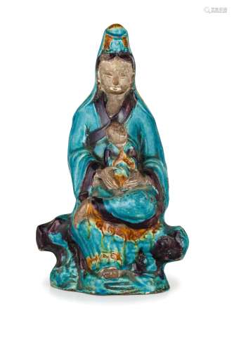 A GLAZED-BISCUIT FIGURE OF GUANYIN AND CHILD, CHINA, 18TH CENTURY