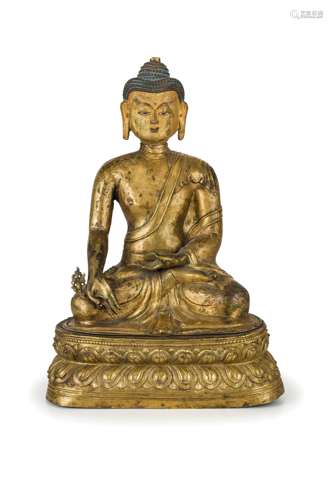 A LARGE AND RARE GILD REPOUSSÉ COPPER ALLOY SEATED FIGURE OF A RATNASAMBHAVA BUDDHA, TIBET, 17TH CENTURY