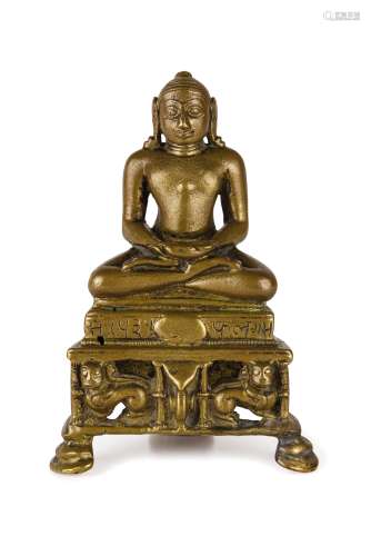 A SMALL BRONZE FIGURE OF A SEATED DEITY, INDIA, 13TH-14TH CENTURY