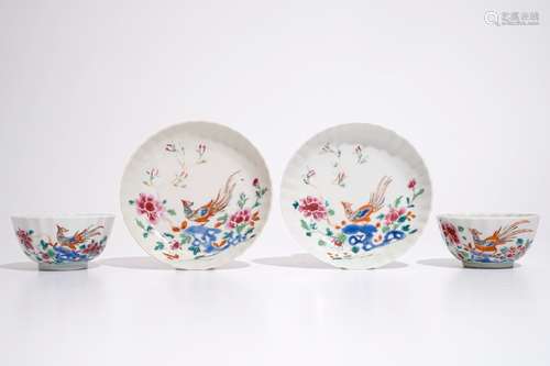 A pair of Chinese famille rose cups and saucers with peacocks, Qianlong