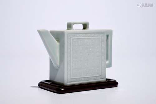 A square Chinese celadon glazed teapot with relief design, Qianlong mark, 19/20th C.