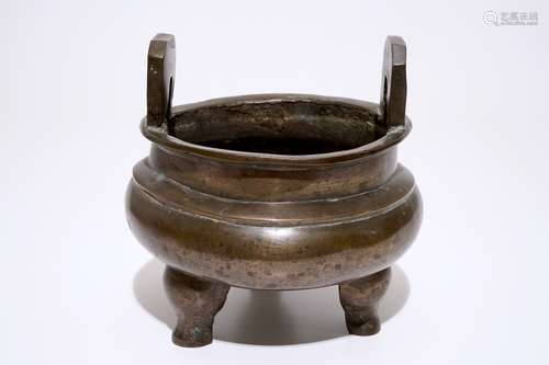 A large Chinese bronze tripod 