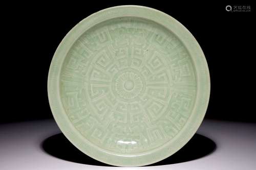 A Chinese celadon dish with incised floral design, 19th C.