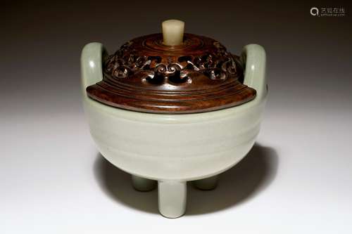 A Chinese tripod celadon censer with jade-inset wooden cover, 19th C.