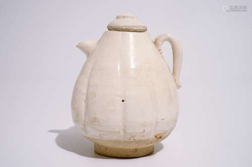 A Chinese cream-glazed melon-shaped ewer and cover, Song