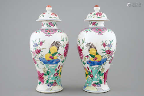 A pair of Chinese famille rose rooster vases and covers, 18/19th C.