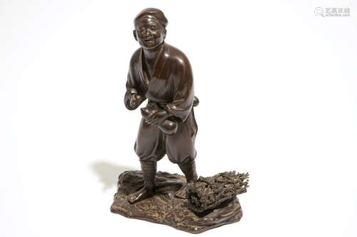 A Japanse bronze figure of a man with a double gourd, Meiji