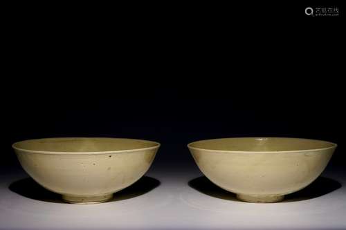 A pair of Chinese monochrome cream-glazed bowls, Northern Song or Jin