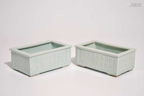 A pair of Chinese relief-decorated celadon-glazed rectangular jardinieres, Yongzheng mark, 19th C.