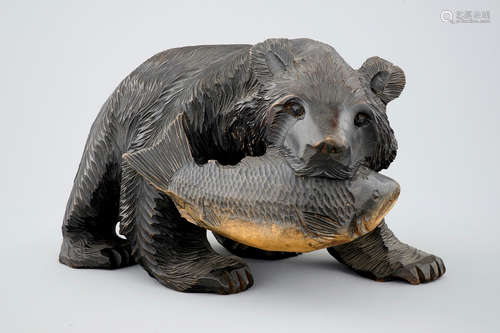 A sculpted and patinated wooden bear, Aino people, Japan, early 20th C.