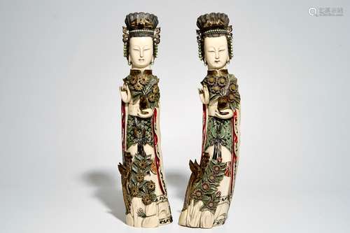 A pair of large polychrome ivory ladies with removable heads, 19/20th C.