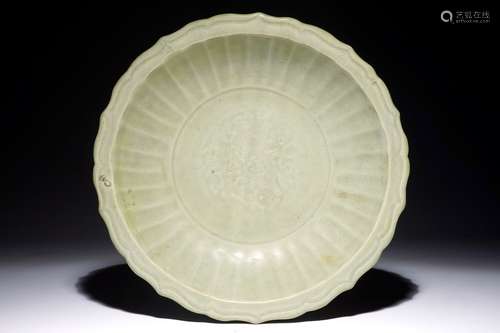 A Chinese Longquan celadon shipwreck dish with underglaze design, Ming