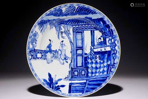 A Chinese blue and white charger with a scene from 