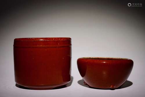 A Chinese monochrome sang-de-boeuf-glazed brush pot and a bowl, 19th C.