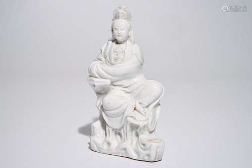 A Chinese Dehua blanc de Chine Guanyin seated on a rock, 18th C.