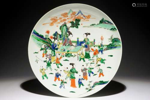 A very large Chinese famille verte dish with ladies and playing boys in a garden, 19th C.