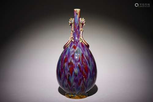 A Chinese monochrome flambe-glazed bottle vase with dragon handles, 19th C.