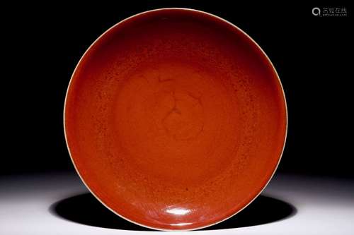 A Chinese monochrome sang-de-boeuf-glazed dish, 19th C.