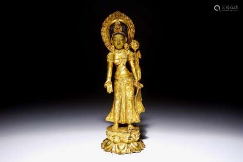 A Chinese gilt bronze figure of Tara standing on a lotus base, 19th C.