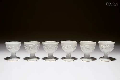 Six Chinese blanc de Chine stem cups with applied floral sprigs, 18/19th C.