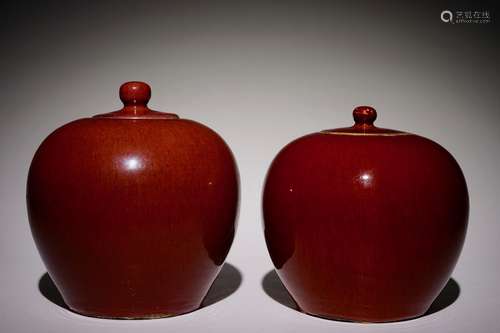 Two Chinese monochrome sang-de-boeuf-glazed covered jars, 19th C.