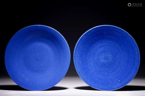 A pair of Chinese blue monochrome dishes, 19th C.