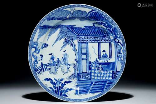 A Chinese blue and white charger with a scene from 