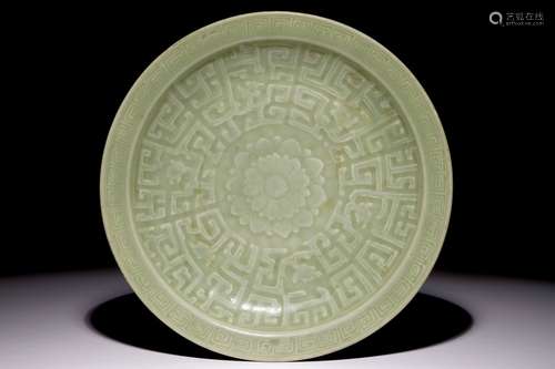 A Chinese celadon dish with incised lotus design, 19th C.