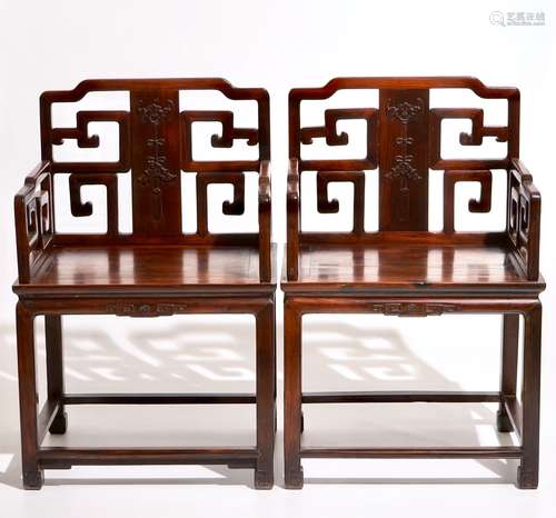 A pair of Chinese carved hardwood chairs, 19th C.