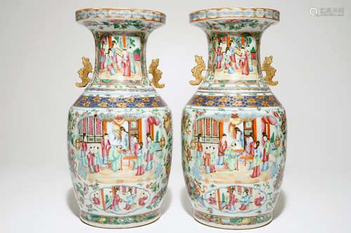 A pair of Chinese Canton famille rose and gilt vases, 19th C.