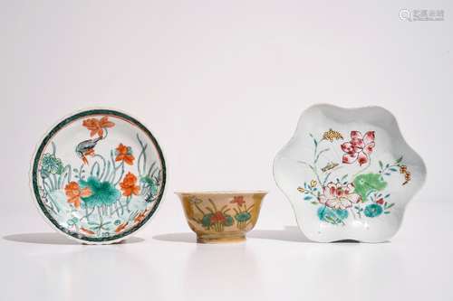 A Chinese famille verte cafe au lait ground cup and saucer, Kangxi, together with a famille rose teapot stand, Yongzheng