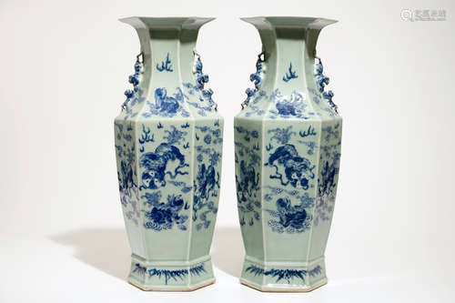 A pair of Chinese hexagonal blue and white on celadon ground vases with buddhist lions, 19th C.