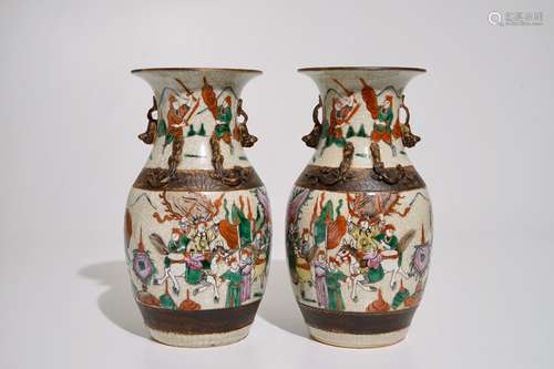 A pair of Chinese famille rose Nanking crackle glaze warrior vases, 19th C.