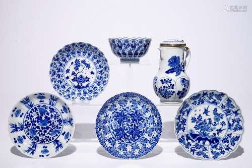 A Chinese blue and white silver-mounted jug and cover, a cup and saucer and three saucer plates, Kangxi