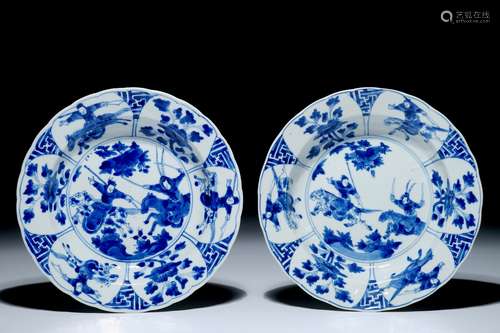 A pair of Chinese blue and white plates with warriors on horseback, Kangxi mark and of the period